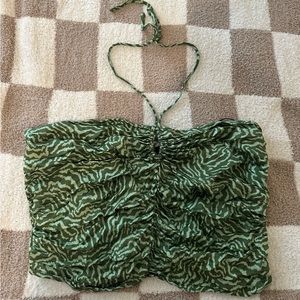 Super cute silk like top that ties around neck. You can dress up or down.